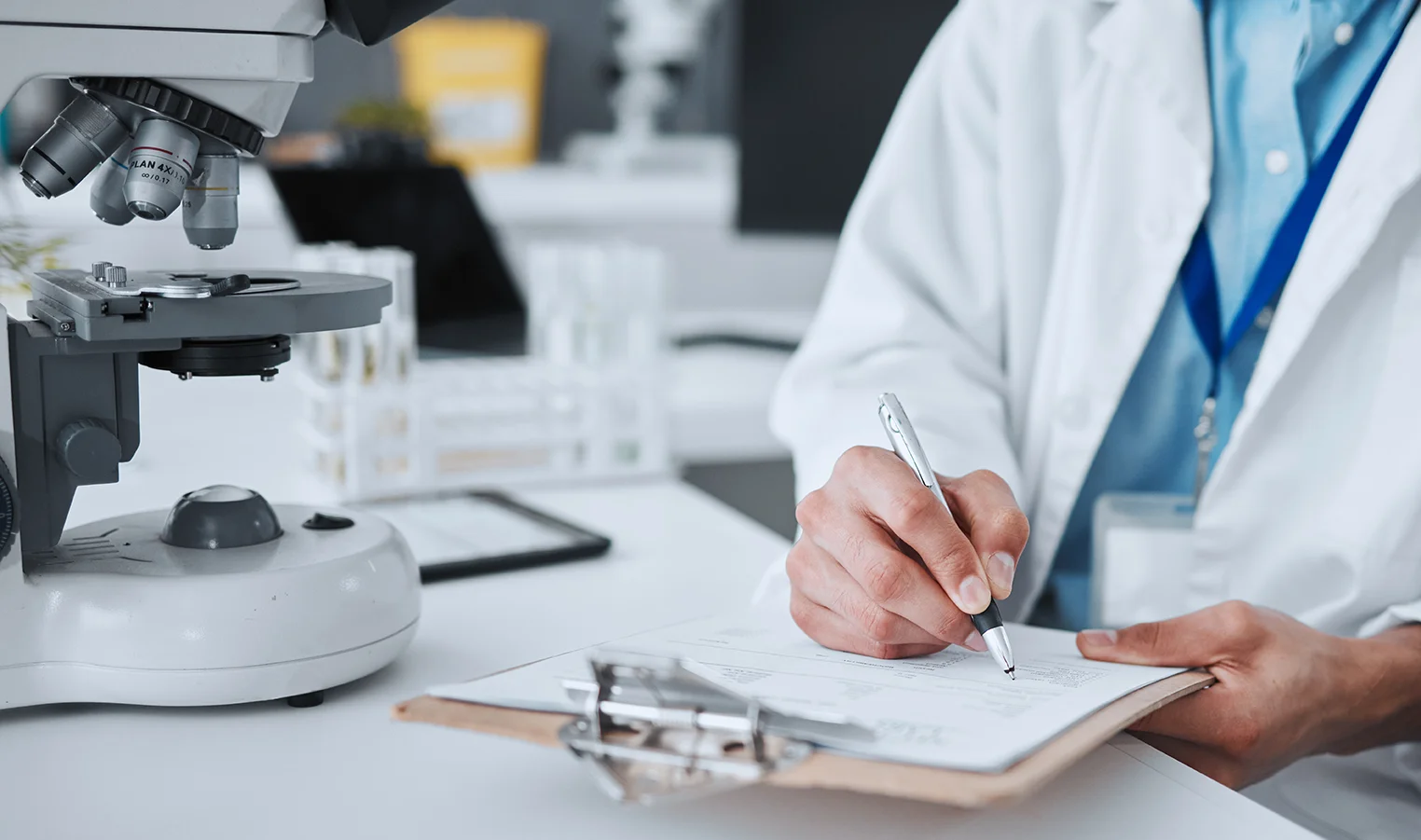 closeup of scientist with clipboard for data, vaccine and study
