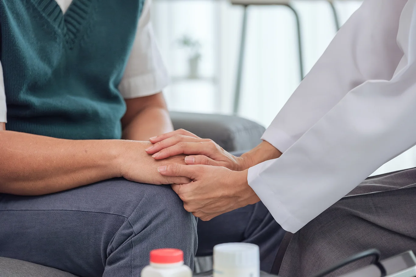 Doctor and senior patient in emotional health care counseling after diagnosis in hospital support setting